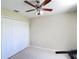 Neutral bedroom with a ceiling fan and a large closet at 18109 Kara Ct, Tampa, FL 33647