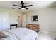 Bedroom featuring neutral walls, double door closet and a wooden dresser at 18109 Kara Ct, Tampa, FL 33647