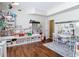 Bonus room with hardwood floors, a table and chairs, a whiteboard, and lots of storage and decor at 18109 Kara Ct, Tampa, FL 33647