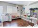 Bonus room with hardwood floors, a window, shelves, cabinets, and lots of books and toys at 18109 Kara Ct, Tampa, FL 33647