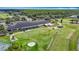 Aerial view of the clubhouse, putting green, driving range and golf cart parking at 18109 Kara Ct, Tampa, FL 33647