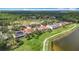 An aerial view of residences on a golf course and water feature in a well-maintained community at 18109 Kara Ct, Tampa, FL 33647