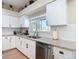 Bright kitchen with white cabinets, stainless steel appliances, and granite countertops at 18109 Kara Ct, Tampa, FL 33647