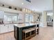 Stylish kitchen with a large island, granite countertops, and modern stainless steel appliances at 18109 Kara Ct, Tampa, FL 33647