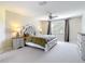 Spacious main bedroom features a large window, ceiling fan and neutral decor at 18109 Kara Ct, Tampa, FL 33647