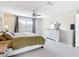 Bright bedroom features carpet, ceiling fan and large window offering lots of natural light at 18109 Kara Ct, Tampa, FL 33647