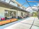 Covered patio with ample seating space and view of backyard at 18109 Kara Ct, Tampa, FL 33647