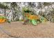 Community playground with multiple slides, climbing structures and swings surrounded by trees at 18109 Kara Ct, Tampa, FL 33647