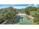 Outdoor playground with green and yellow play structures for climbing and sliding in the community at 18109 Kara Ct, Tampa, FL 33647