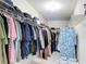 Walk-in closet features organized hanging storage with wire shelving and racks at 18109 Kara Ct, Tampa, FL 33647