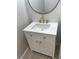 Elegant bathroom featuring decorative wallpaper, a marble countertop, brushed gold fixtures, and sleek vanity design at 18875 Noble Caspian Dr, Lutz, FL 33558