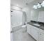 Well-lit bathroom features a shower-tub combo and granite vanity at 18875 Noble Caspian Dr, Lutz, FL 33558