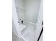 Tiled laundry room featuring open shelving and washer and dryer hookups at 18875 Noble Caspian Dr, Lutz, FL 33558