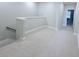 Upstairs loft space featuring neutral paint, carpet, and natural lighting at 18875 Noble Caspian Dr, Lutz, FL 33558