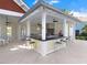 Community outdoor kitchen with stainless steel appliances and bar at 18875 Noble Caspian Dr, Lutz, FL 33558
