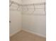 Walk-in closet with wire shelving at 18875 Noble Caspian Dr, Lutz, FL 33558