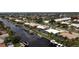 Stunning aerial view of waterfront homes along canals, showcasing prime real estate and boating access at 260 Coronado Dr, Punta Gorda, FL 33950