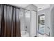 Bathroom featuring a shower-tub combo with tiled surround, a closet and pool access at 260 Coronado Dr, Punta Gorda, FL 33950