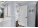 Bright bathroom vanity with a white countertop and door to the water closet at 260 Coronado Dr, Punta Gorda, FL 33950