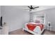 Cozy bedroom showcasing a queen bed, side tables, and a sunlit window at 260 Coronado Dr, Punta Gorda, FL 33950