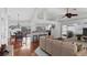 Open-concept living space with hardwood floors and views of dining, bar seating and the screened-in pool at 260 Coronado Dr, Punta Gorda, FL 33950