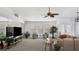 Comfortable living room with neutral tones, ceiling fan, and ample natural light, creating an inviting atmosphere at 260 Coronado Dr, Punta Gorda, FL 33950