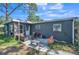 A cozy backyard with a patio set, grill, and clay pot at 6014 Sheelin Dr, New Port Richey, FL 34653