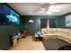 Living room features a large flat-screen TV and cozy seating area at 6014 Sheelin Dr, New Port Richey, FL 34653