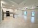 Spacious open floor plan kitchen and living area with stainless appliances, granite countertops, and bright recessed lighting at 1732 Rada Ln, North Port, FL 34288
