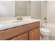 Standard bathroom with a vanity cabinet, toilet, and tiled shower-tub combo at 11621 Ashton Field Ave, Riverview, FL 33579
