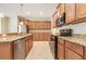 Bright kitchen with granite countertops, stainless steel appliances, and ample cabinet space at 11621 Ashton Field Ave, Riverview, FL 33579