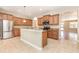 Updated kitchen with stainless steel appliances and granite countertops and abundant cabinetry at 11621 Ashton Field Ave, Riverview, FL 33579