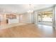 Spacious living room with access to a screened patio, seamlessly connecting indoor and outdoor living spaces at 11621 Ashton Field Ave, Riverview, FL 33579