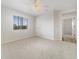 Bedroom with a ceiling fan, window, and access to other rooms at 13210 Essman Ave, Port Charlotte, FL 33953