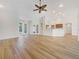 Open concept living space featuring wood floors, recessed lighting, and access to outdoor areas at 13210 Essman Ave, Port Charlotte, FL 33953