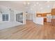 Open concept living space with light laminate flooring and natural light throughout at 13210 Essman Ave, Port Charlotte, FL 33953