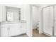 Bathroom featuring double vanity with granite counter, framed mirror, and glass-enclosed shower at 1740 Brekey Way, Zephyrhills, FL 33541