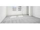 Bedroom featuring neutral carpet, a double window, and a closet at 1740 Brekey Way, Zephyrhills, FL 33541