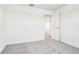 Bright bedroom with carpet and a doorway to another room at 1740 Brekey Way, Zephyrhills, FL 33541