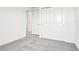 Carpeted bedroom featuring doorways and closet at 1740 Brekey Way, Zephyrhills, FL 33541