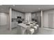 Modern kitchen featuring stainless appliances, white cabinetry, light countertops, and an island with barstool seating at 1740 Brekey Way, Zephyrhills, FL 33541