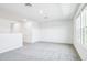 Bright loft area with neutral carpet, perfect for a playroom or additional living space at 1740 Brekey Way, Zephyrhills, FL 33541