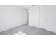 Bright bedroom with neutral carpet and a closet with paneled sliding doors at 1799 Draughton Dr, Zephyrhills, FL 33541