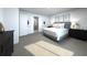 Serene bedroom with neutral tones, plush carpeting, and elegant furnishings at 1799 Draughton Dr, Zephyrhills, FL 33541