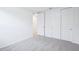 Bedroom with neutral carpet, white walls, and paneled closet doors at 1799 Draughton Dr, Zephyrhills, FL 33541