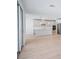 Open-concept kitchen features sleek gray cabinets, stainless appliances, and a center island at 1799 Draughton Dr, Zephyrhills, FL 33541