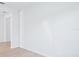 Spacious living room with wood floors and bright white walls at 1799 Draughton Dr, Zephyrhills, FL 33541