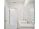 Contemporary bathroom featuring double sinks with quartz countertops, and large mirror at 1859 Draughton Dr, Zephyrhills, FL 33541