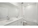 Clean bathroom with double sinks, quartz countertops, and a shower-tub combination at 1859 Draughton Dr, Zephyrhills, FL 33541