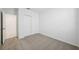 Cozy bedroom with plush carpeting and a closet with sliding doors at 1859 Draughton Dr, Zephyrhills, FL 33541